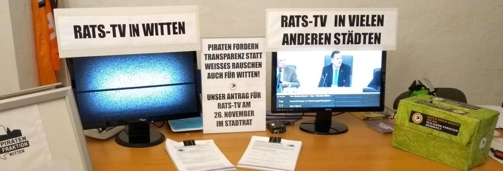 Zwei Monitore: Links weißes Rauschen als Symbol für das fehlende Rats-TV in Witten, rechts Rats-TV in Wuppertal.